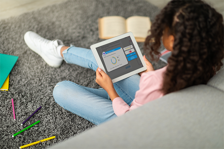 Child completing work on CENTURY's AI-powered learning platform