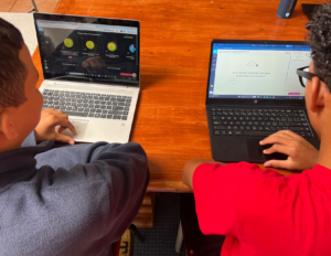 Two Chatmore International School students completing work on the CENTURY platform.