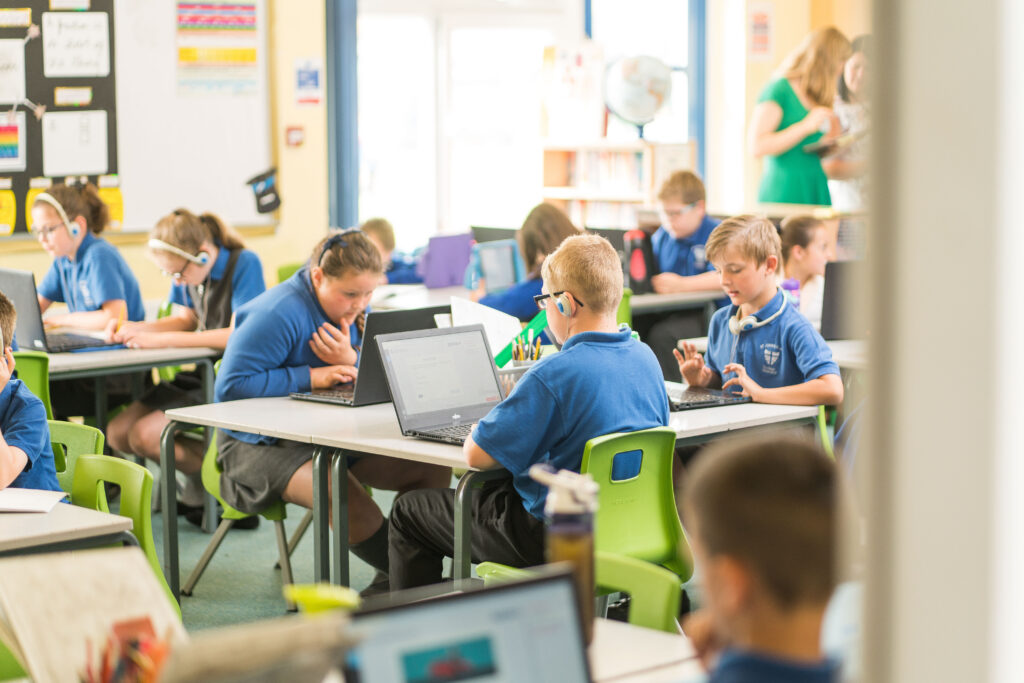 Primary school pupils working on CENTURY in a classroom